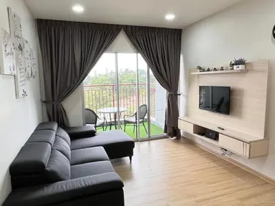 a living room with a couch and a television at FY Friends at Emerald Avenue Brinchang in Tanah Rata