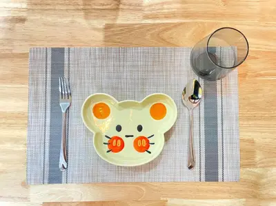 a plate with a hello kitty face on it on a table at Space of Tranquility Quintet in Tanah Rata