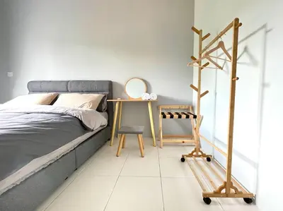 a bedroom with a bed and a desk and a chair at Removed listing in Tanah Rata