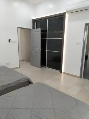 a bedroom with a bed and sliding glass doors at PANGKOR Villa 88 L26 Homestay in Kampong Sungai Udang