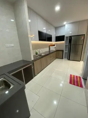a large kitchen with a sink and a refrigerator at PANGKOR Villa 88 L26 Homestay in Kampong Sungai Udang