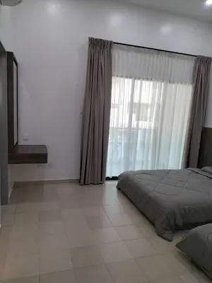 a bedroom with a bed and a large window at PANGKOR Villa 88 L26 Homestay in Kampong Sungai Udang
