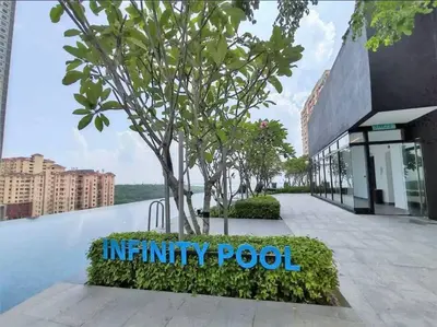 a sign that reads infinity pool in front of a building at Perfect KTV Set & Netflix 3 Queen Bed Seaview in Jelutong