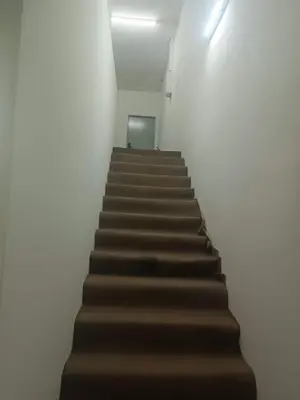 a stairway in a building with a stair case at Jstay guesthouse in George Town