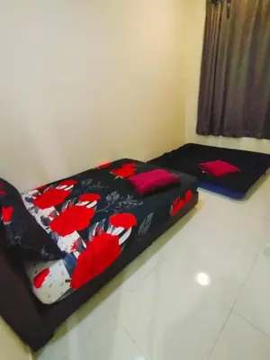 a bed in a room with a black and red blanket at WeJDAN TWO POINT O WHOLE HOUSE BUT BUDGET PARTIAL BOOKING 2ROOMS 2BATHROOMS AND NEVER MIX WITH OTHERS AND YOUR TEAM ONLY BALIK PULAU, PENANG ISLAND in Balik Pulau
