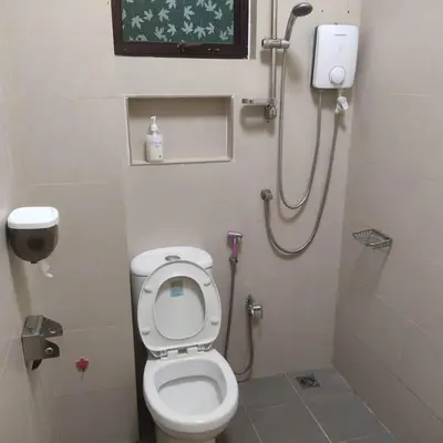 a small bathroom with a toilet and a shower at WeJDAN TWO POINT O WHOLE HOUSE BUT BUDGET PARTIAL BOOKING 2ROOMS 2BATHROOMS AND NEVER MIX WITH OTHERS AND YOUR TEAM ONLY BALIK PULAU, PENANG ISLAND in Balik Pulau