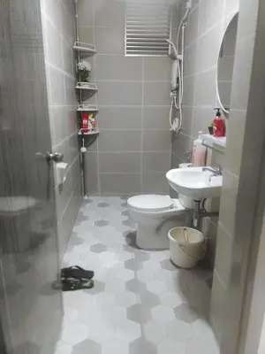 a bathroom with a toilet and a sink at Meeymohd Homestay in Ipoh