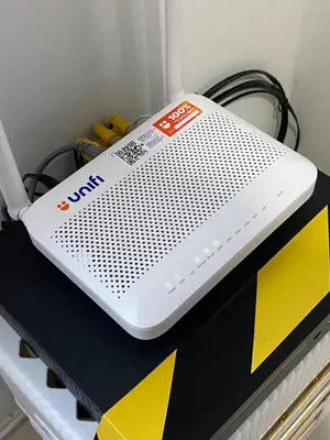 a white appliance sitting on top of a shelf at Deandra Homestay- WiFi-Aircond-Dryer in Sungai Petani