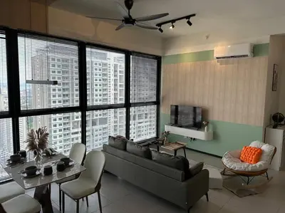 a living room with a couch and a table at High Floor, 3BR 3queen bed, 2 parking, Urban Suites by XWHome in Jelutong