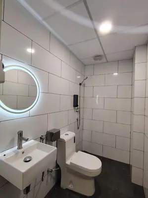 a bathroom with a toilet and a sink at The great hotel greenhill in Ipoh