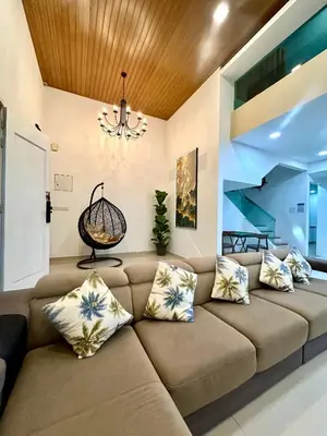 a living room with a couch and a chandelier at Stylish Villa Alma 18-23 Guests - Pool, KTV & BBQ in Simpang Ampat