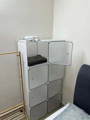 a stack of white drawers in a room at TuR05-Pisa Stadium-3room-Private in Bayan Lepas