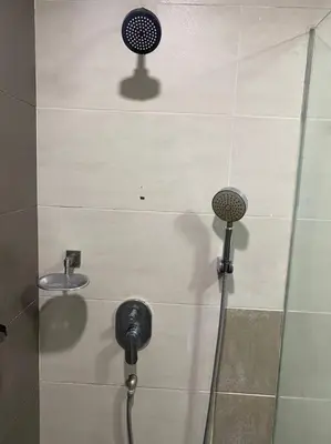 a shower in a bathroom with a shower head at Brinchang Cameron 2R2B 10 paxs KeaFarm #14402 in Brinchang
