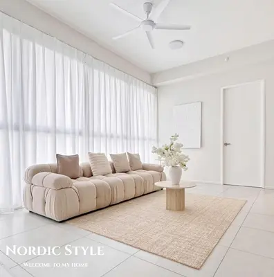 a living room with a couch and a table at Georgetown Seaview & Cityview Skypool with 2 Carpark in Jelutong