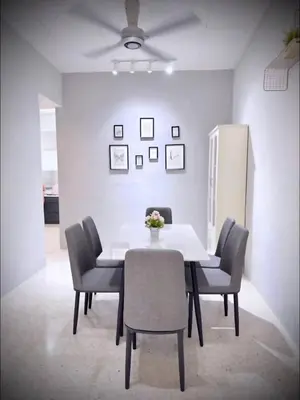 a dining room with a white table and chairs at M & V butterworth in Butterworth