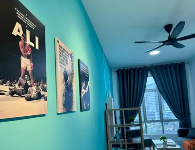 a living room with posters on the wall at Ipoh Midtown Anderson Suite 2R2B in Ipoh