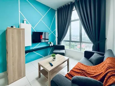 a blue living room with a couch and a table at Ipoh Midtown Anderson Suite 2R2B in Ipoh