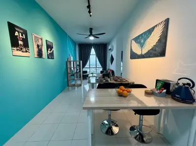 a living room with blue walls and a table at Ipoh Midtown Anderson Suite 2R2B in Ipoh