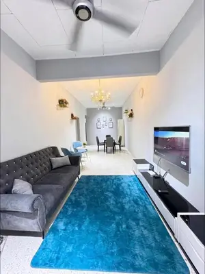 a living room with a couch and a tv at Mk&V butterworth in Butterworth