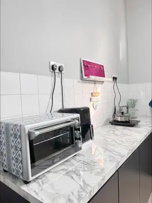 a microwave sitting on a counter in a kitchen at Mk&V butterworth in Butterworth