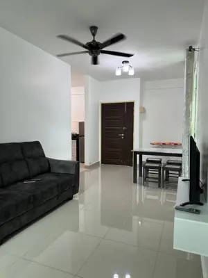 a living room with a couch and a ceiling fan at Spc Arena Apartment Service in Bayan Lepas