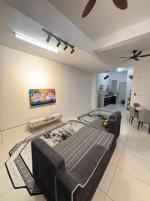 a bedroom with a bed in the middle of a room at Hz homestay in Simpang Ampat