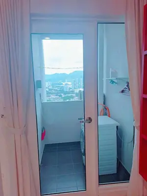 a bathroom with a shower and a toilet and a window at Straits Garden Suites Georgetown Penang 1BRcondo in George Town