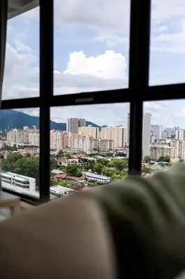 a view of a city from a window at UA19 #3BR 3 Queen Bed #Family Staycation in Jelutong