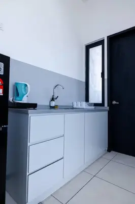 a white kitchen with a sink and a window at #U27 #3BR Family Staycation in Jelutong