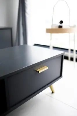a black table with a drawer in a room at #U27 #3BR Family Staycation in Jelutong