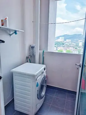 a washing machine in a bathroom with a window at 1BR Condo Straits Garden Suites Georgetown Penang in George Town