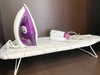 a white and purple computer monitor sitting on a bench at 2bedroom 2bath 13th Seaview MansionOne Gurney in George Town