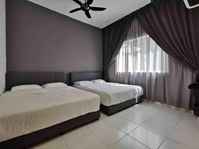 a bedroom with two beds and a ceiling fan at Arcadia Homes 3A The Quintet, Cameron Highlands in Tanah Rata