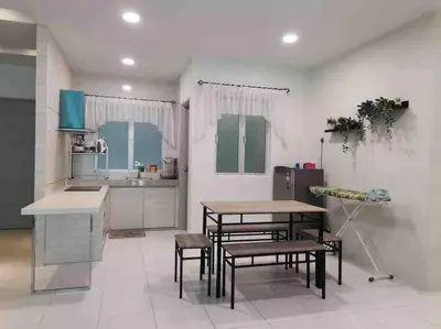 a kitchen with a table and some chairs in it at Arcadia Homes 3A The Quintet, Cameron Highlands in Tanah Rata