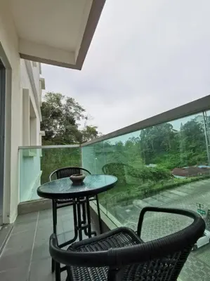 a table and chairs on a balcony with a view at Arcadia Homes 3A The Quintet, Cameron Highlands in Tanah Rata