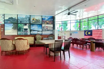 a dining room with a table and chairs at B Hotel Penang in George Town