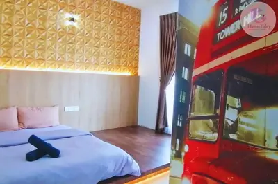 a bedroom with a bed and a double decker bus at The Majestic Condo Ipoh Home Fairy 2 in Ipoh