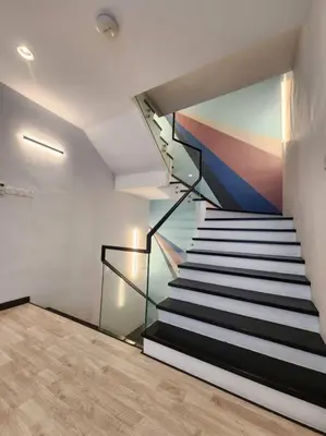 a staircase in a house with a painting on the wall at 5min to juru & bukit minyak industrial semi D in Bukit Mertajam