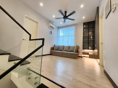 a living room with a couch and a ceiling fan at 5min to juru & bukit minyak industrial semi D in Bukit Mertajam