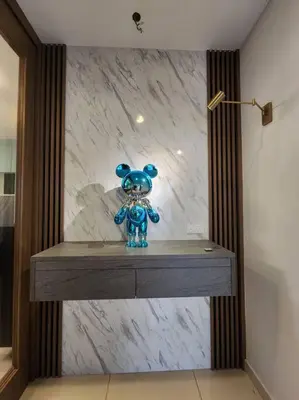 a blue toy sitting on a counter in front of a marble wall at 5min to juru & bukit minyak industrial semi D in Bukit Mertajam