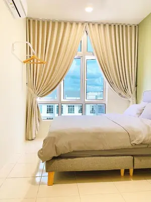 a bedroom with a bed and a large window at The Floral Dawn Anderson in Kampong Simee