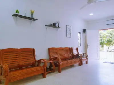 three wooden benches sitting in a room at Gioia DeGarden in Taiping