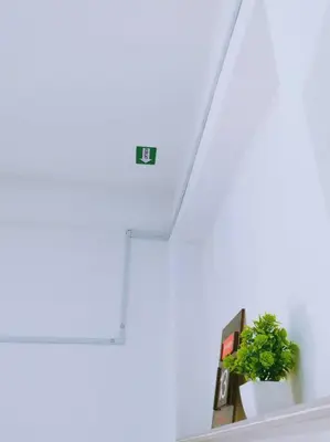 a plant sitting on a shelf next to a staircase at Gioia DeGarden in Taiping
