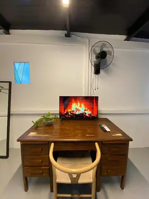 a room with a desk with a laptop on top of it at Bayu Bayu Hotel by Soft Loft in Tanjung Bungah