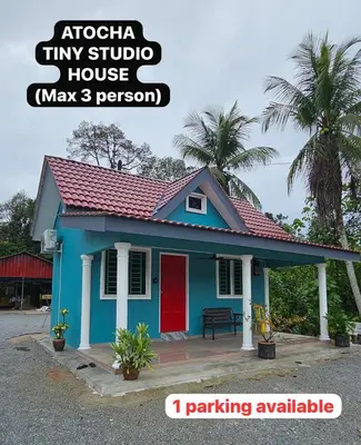 a small blue house with a red door at Atocha Tiny Studio House - Temerlok Terong, Perak - max 3 person only in Kampong Salak