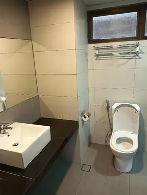 a bathroom with a sink and a toilet at Cozy Nest 1 Bedroom Apartment at Equatorial Hill Resort in Brinchang