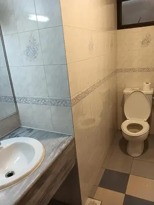 a bathroom with a toilet and a sink at Cozy Nest 1 Bedroom Apartment at Equatorial Hill Resort in Brinchang