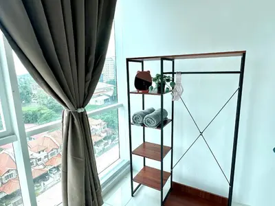 a room with a window with a curtain at Fabulous Airport 2BR Suite# Straits Intl# Msg Chair in Bayan Lepas