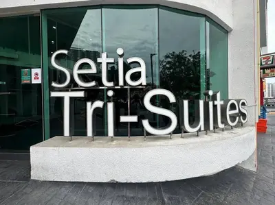 a building with a sign that reads sittia tri cities at Fabulous Airport 2BR Suite# Straits Intl# Msg Chair in Bayan Lepas