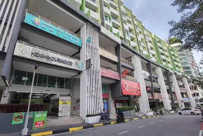 a large building on a city street with a street at Fabulous Airport 2BR Suite# Straits Intl# Msg Chair in Bayan Lepas